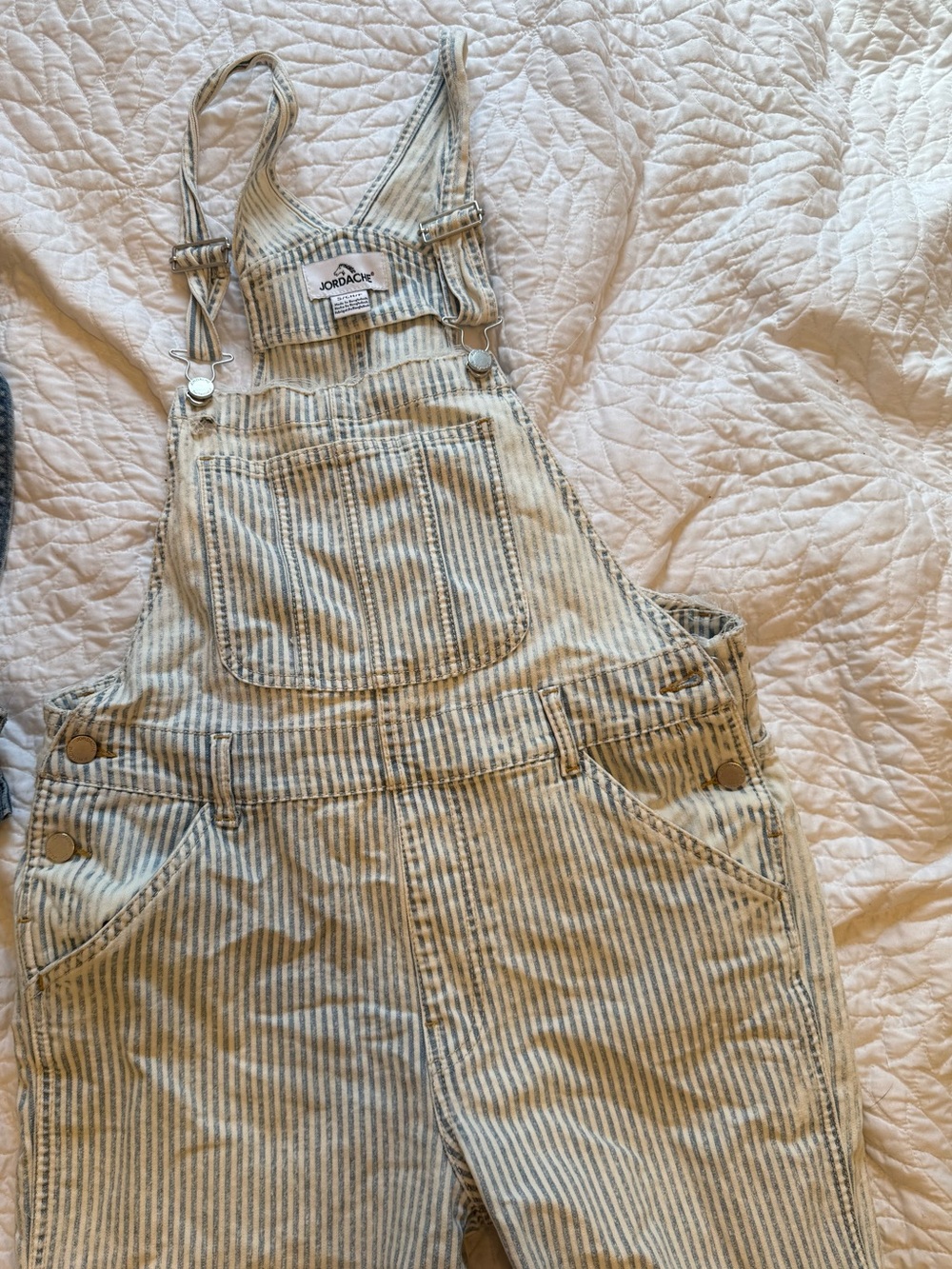 Distressed light stripped overalls